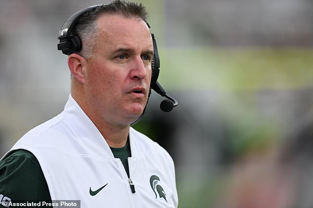 FILE - Michigan State head coach Pat Fitzgerald watches his team play Illinois in the second half of an NCAA college football game, Oct. 10, 2026, in East Lansing, Mich. (AP Photo/Lon Horwedel, File)