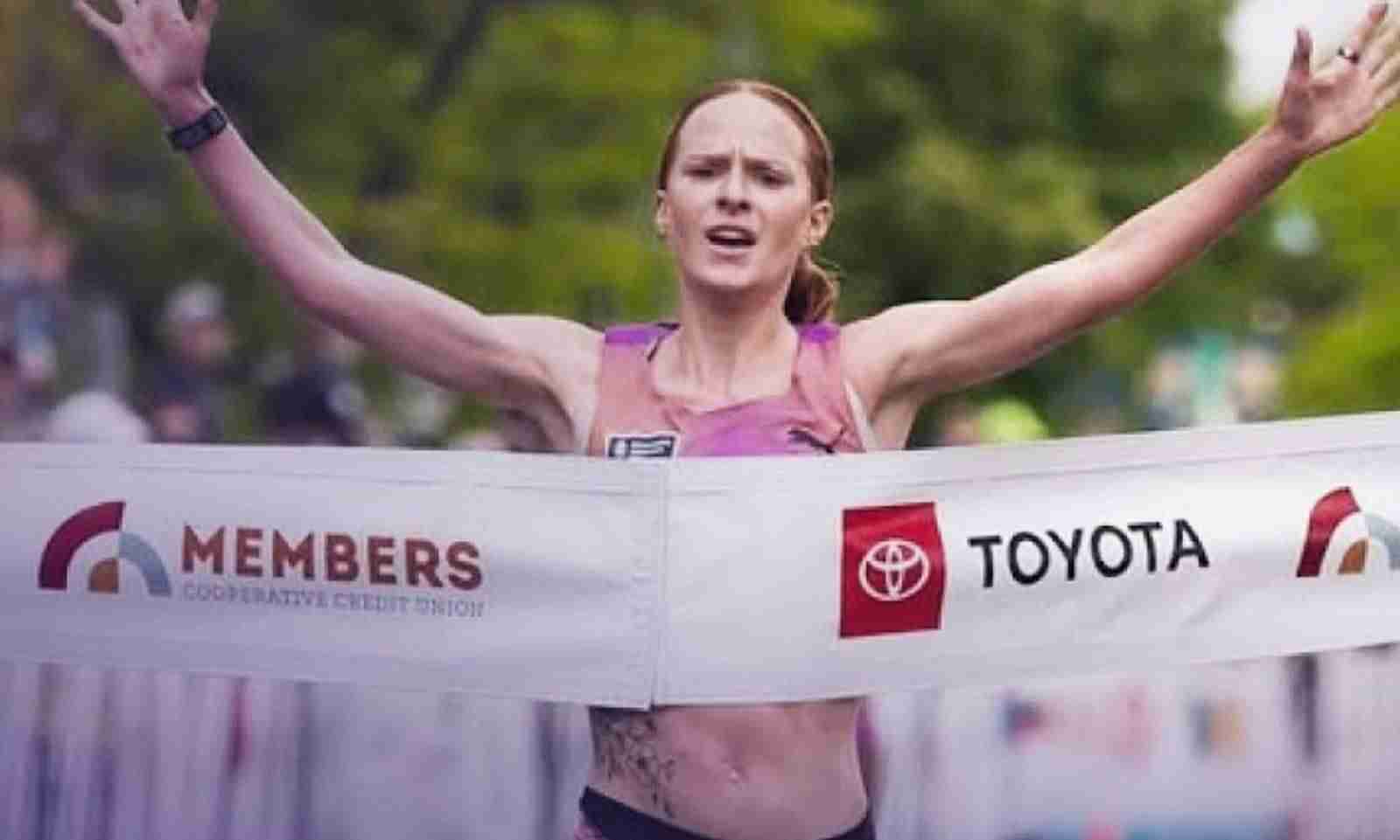 Annie Frisbie of USA celebrates crossing the finish line