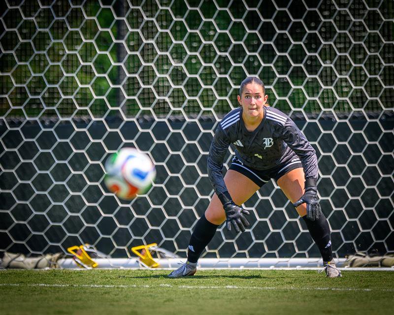 Baylor School goal keeper Ella Metzner prepares to block a kick for the Lady Raiders.