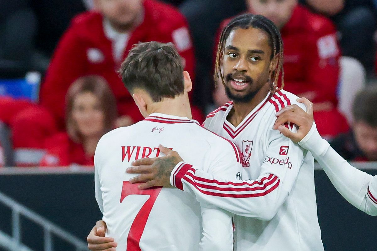 Bradley Barcola of Liverpool FC celebrates after scoring his teams second goal with Florian Wirtz of Liverpool FC and Rio Ngumoha 