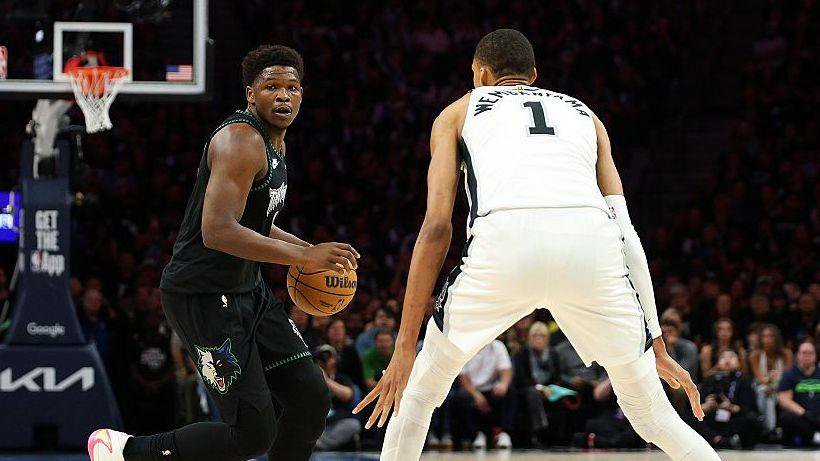 Anthony Edwards #5 of the Minnesota Timberwolves dribbles the ball against Victor Wembanyama #1 of the San Antonio Spurs in the first quarter in Game Six of the Second Round of the NBA Western Conference Playoffs 