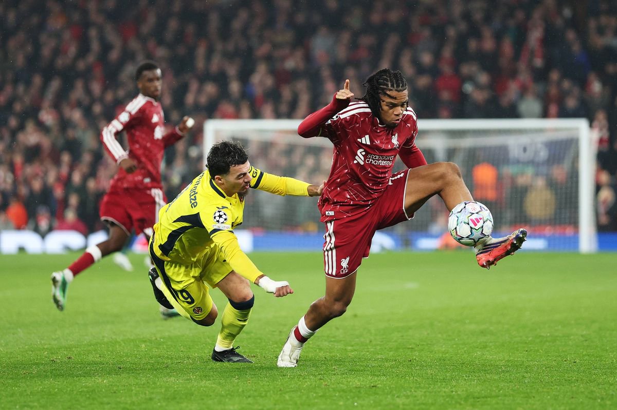 LIVERPOOL, ENGLAND - OCTOBER 20: Rio Ngumoha of Liverpool runs with the ball away from Georges Mikautadze of Villarreal CF during the UEFA Champions League 2026/27 League Phase MD3 match between Liverpool FC and Villarreal CF at Anfield on October 20, 2026 in Liverpool, England. (Photo by Dan Istitene/Getty Images)