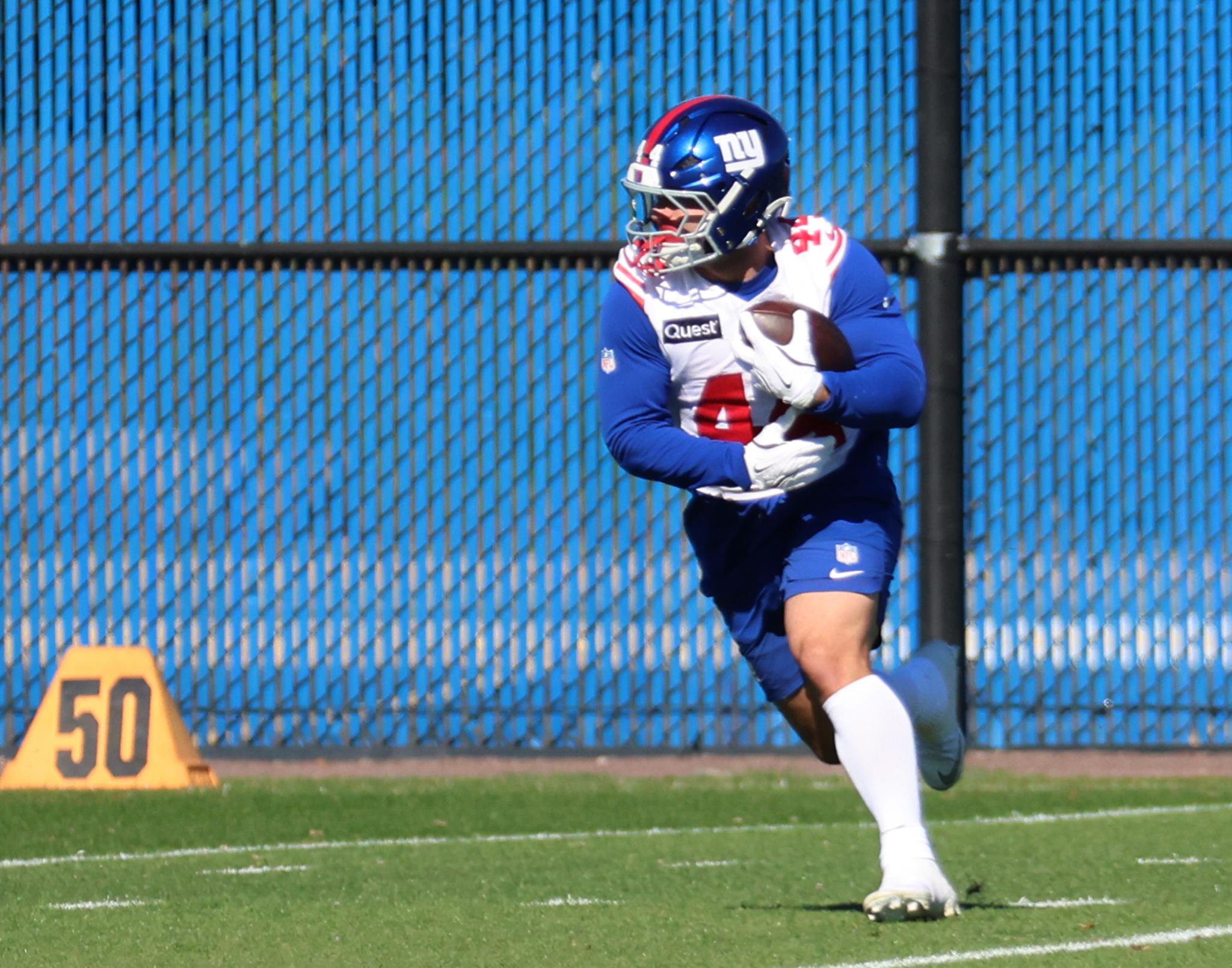 Giants running back Cam Skattebo #44, running with the ball during practice at the New York Giants training facility in East Rutherford, New Jersey