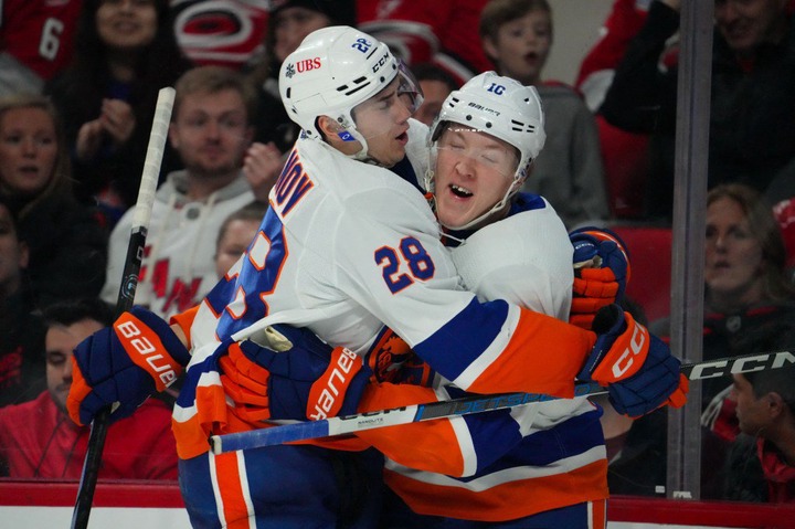 Simon Holmstrom (right) is congratulated by Alexander Romanov after scoring a goal in the Islanders' 5-4 win over the Hurricanes.