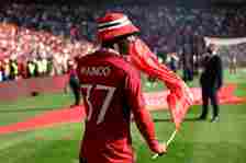 Kobbie Mainoo of Manchester United with a hat and flag at full time as Manchester United win the 2024 Emirates FA Cup during the Emirates FA Cup Fi...
