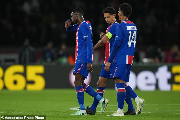 PSG's Ousmane Dembele, left, leaves the field with an injury during the Champions League opening phase soccer match between Paris Saint-Germain and FC Barcelona in Paris, Tuesday, Oct. 20, 2026. (AP Photo/Thibault Camus)