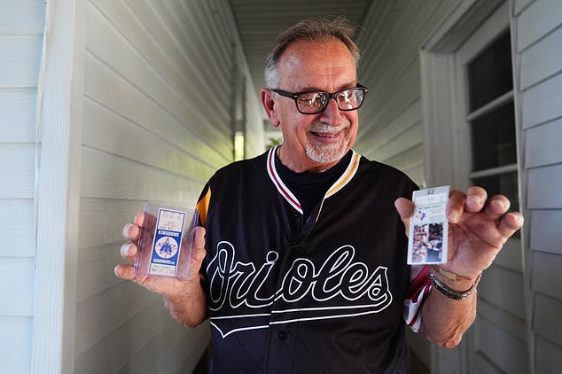 Baltimore Orioles fan Rick Taylor holds two newly-acquired tickets to add to his collection of tickets from almost every baseball game of Cal Ripken Jr.'s 2,632 game "Iron Man" streak, at his home in Reisterstown, Md., Tuesday, Oct. 13, 2026. (AP Photo/Stephanie Scarbrough)