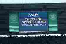 The LED board shows the VAR check for a red card decision awarded to John Lundstram of Rangers during the Cinch Scottish Premiership match between ...