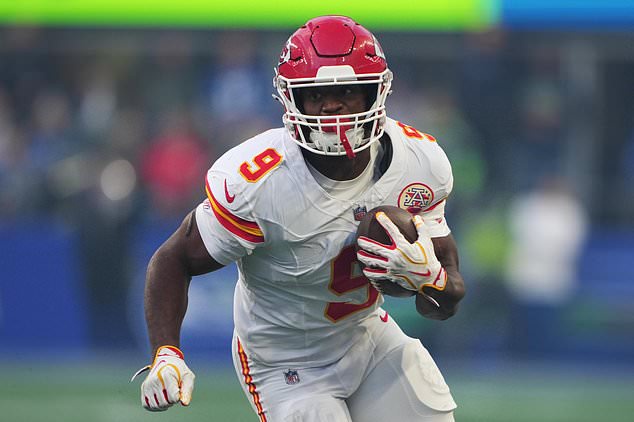 Kansas City Chiefs running back Kenneth Walker III runs the ball during the first half of an NFL football game against the Seattle Seahawks in Seattle, Sunday, Oct. 25, 2026. (AP Photo/Lindsey Wasson)
