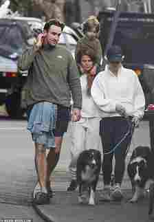 He kept comfortable in a pair of black trainers as he stepped out on a dog walk with Vail and her son Jack, who she had in a previous relationship