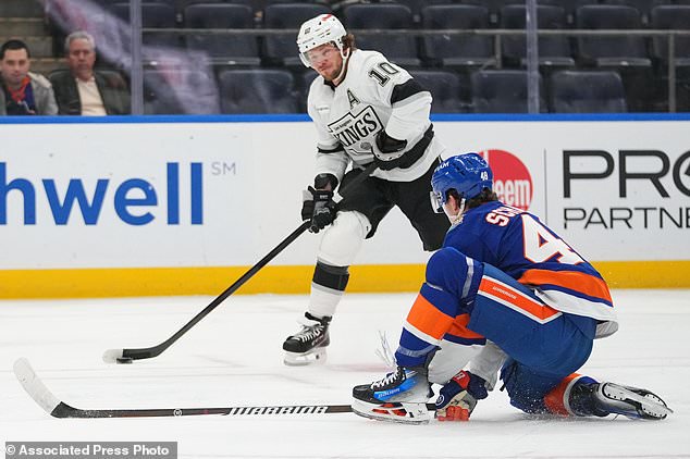 New York Islanders' Matthew Schaefer (48) defends a shot by Los Angeles Kings' Artemi Panarin (10) during the first period of an NHL hockey game Thursday, Oct. 22, 2026, in Elmont, N.Y. (AP Photo/Frank Franklin II)