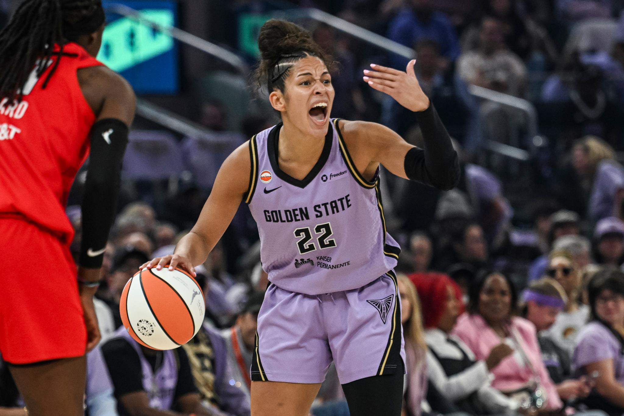 Veronica Burton playing basketball in a game.