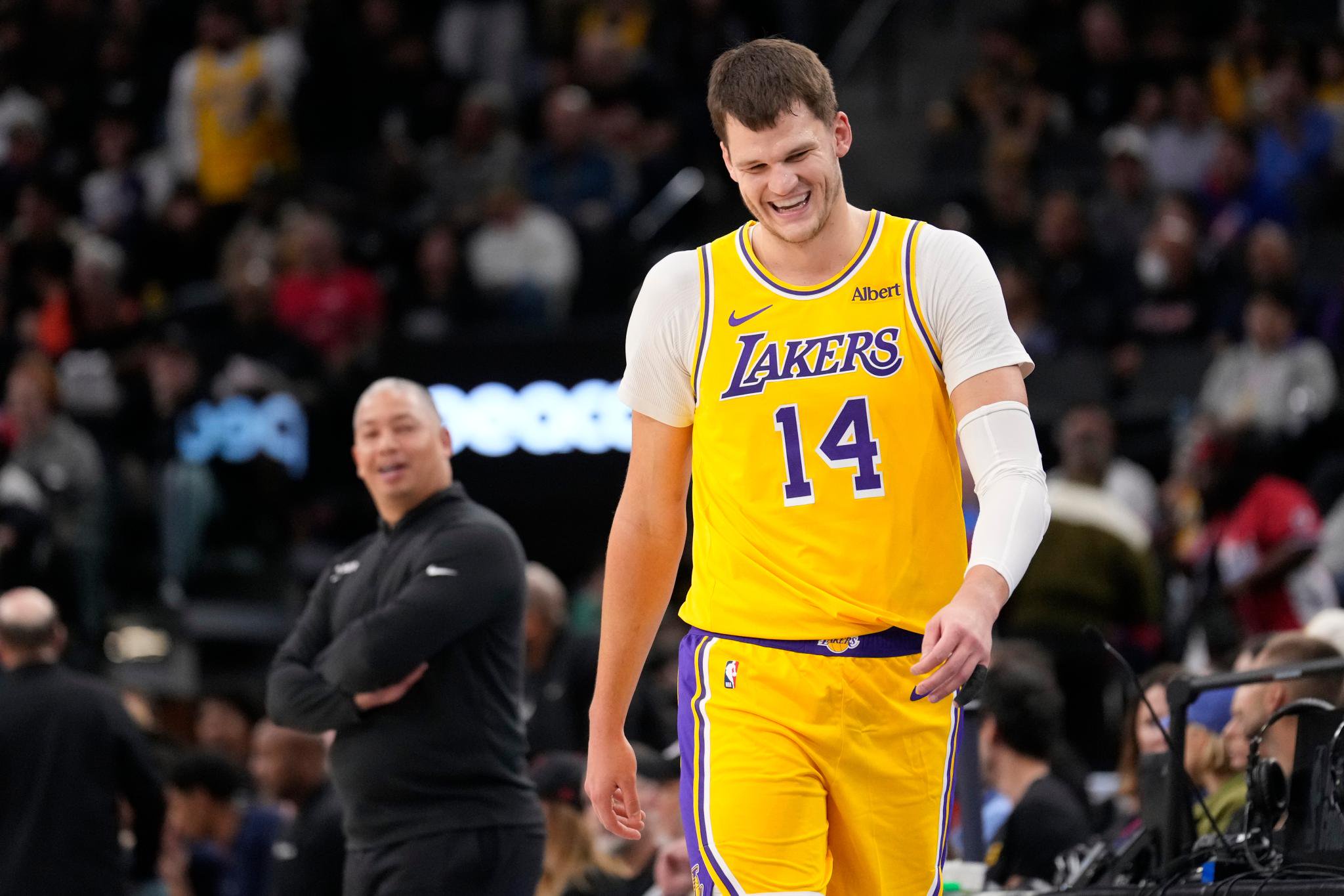 Los Angeles Lakers center Walker Kessler, right, laughs after talking with Los Angeles Clippers head coach Tyronn Lue, left, during the second half of an NBA basketball game Thursday, Oct. 29, 2026, in Inglewood, Calif.