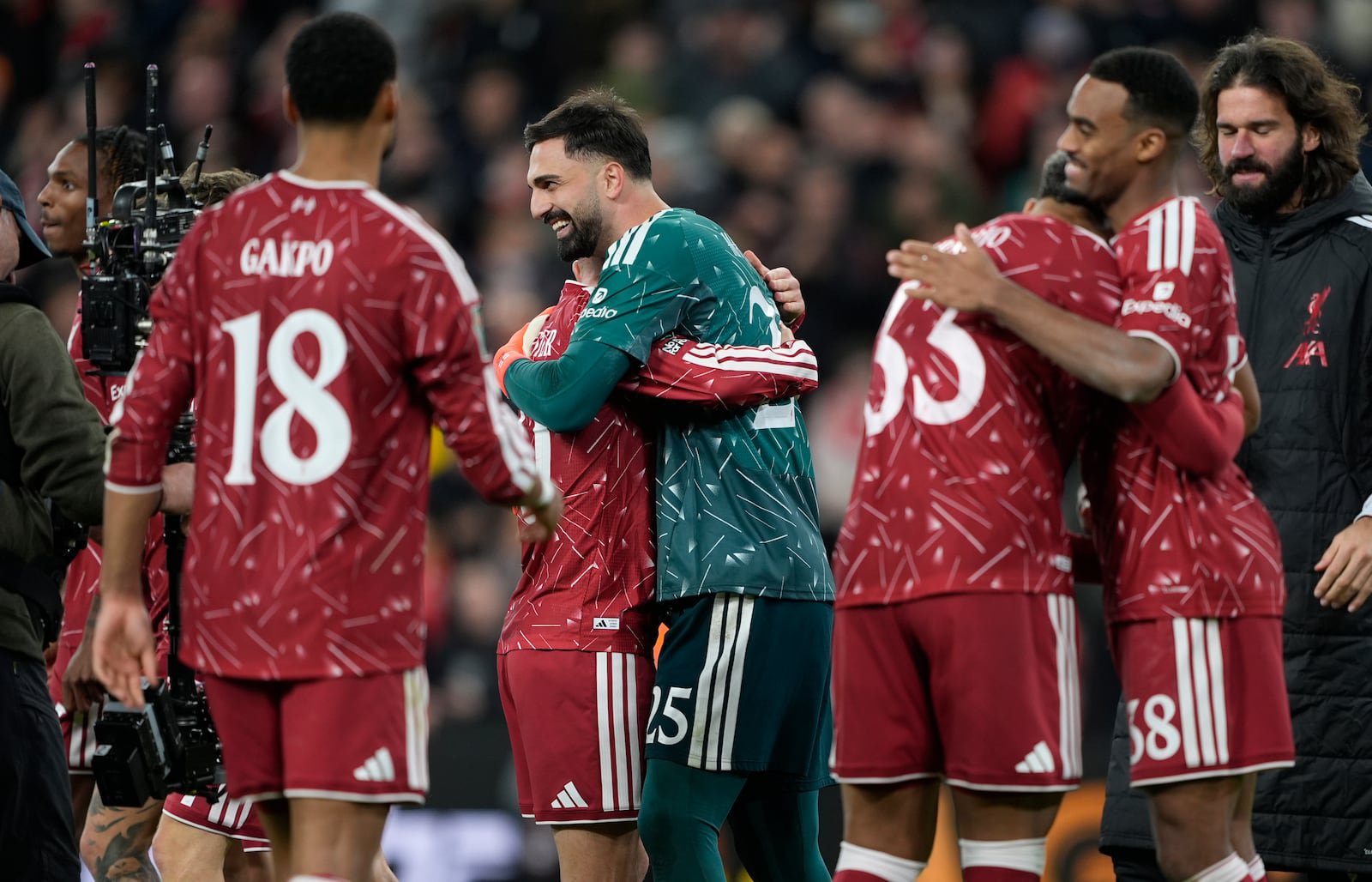 Liverpool goalkeeper Giorgi Mamardashvili (centre) celebrates with his team-mates after beating Chelsea on penalties at Anfield. Photograph: Peter Byrne/PA