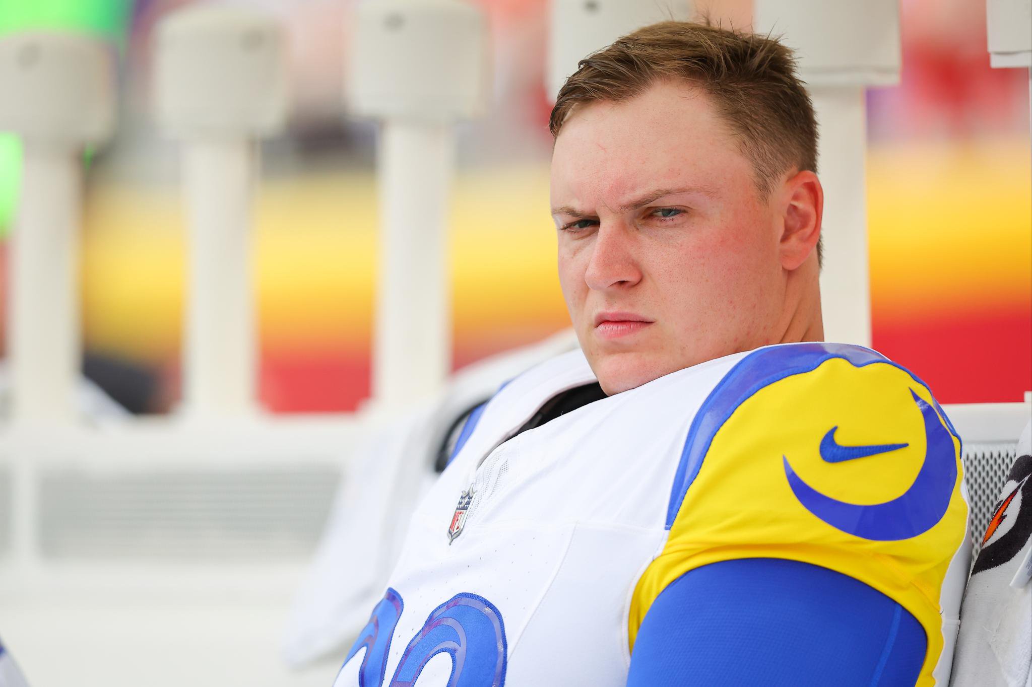 Los Angeles Rams place kicker Harrison Mevis sits on the team bench during pregame warmups.