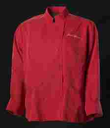 A red chef's coat against a black background