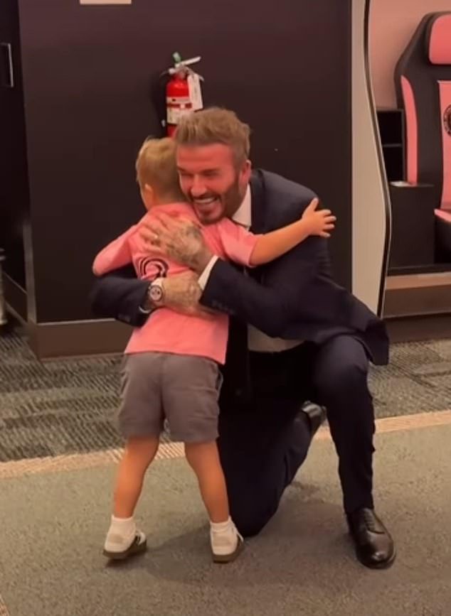 Heartwarming: David Beckham shared a hug and a high-five with a boy who has Down syndrome in an adorable moment posted online