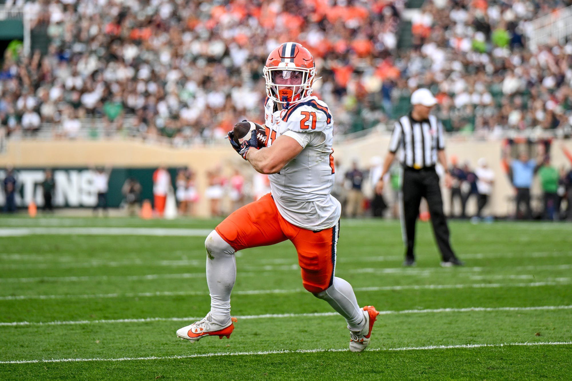 Illinois’ Aidan Laughery runs for a touchdown after a catch against Michigan State during the first quarter on Saturday, Oct. 10, 2026, at Spartan Stadium in East Lansing.