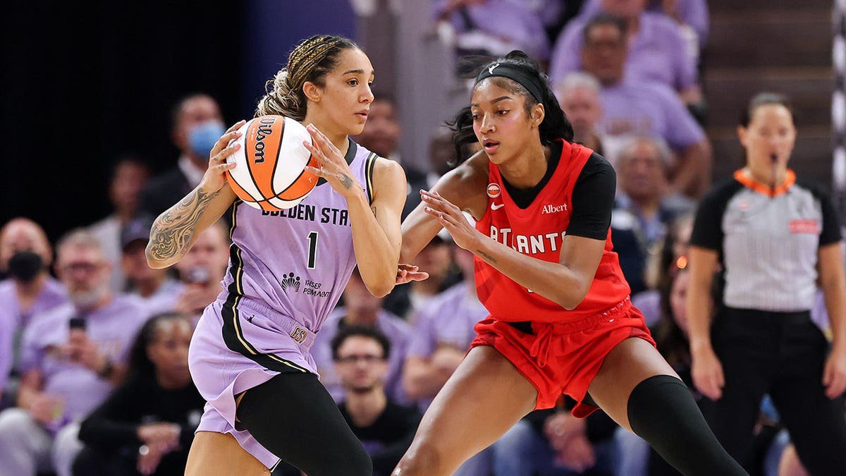Gabby Williams #1 of the Golden State Valkyries is defended by Angel Reese #5 of the Atlanta Dream.