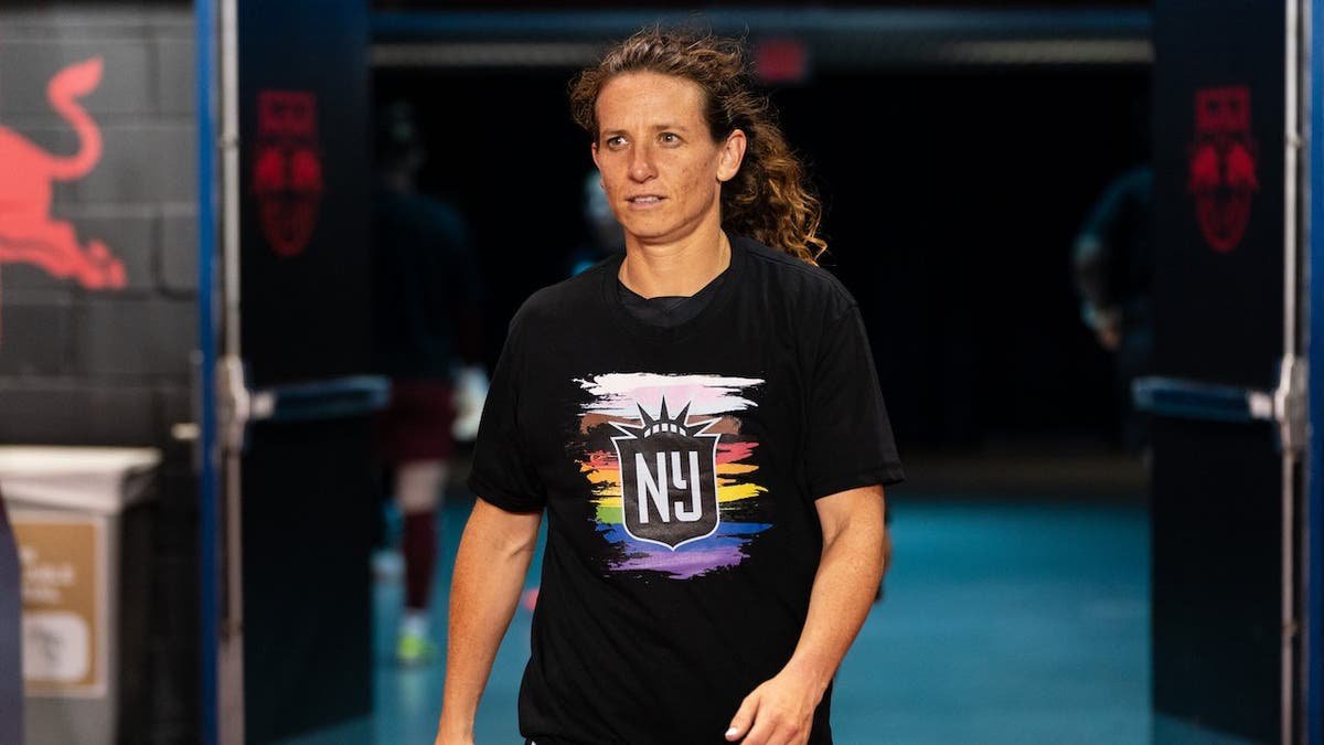 Elizabeth Eddy stands before a game at Red Bull Arena.