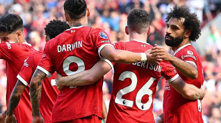 Liverpool players celebrate Mohamed Salah's goal against Aston Villa in the Premier League in September 2023.