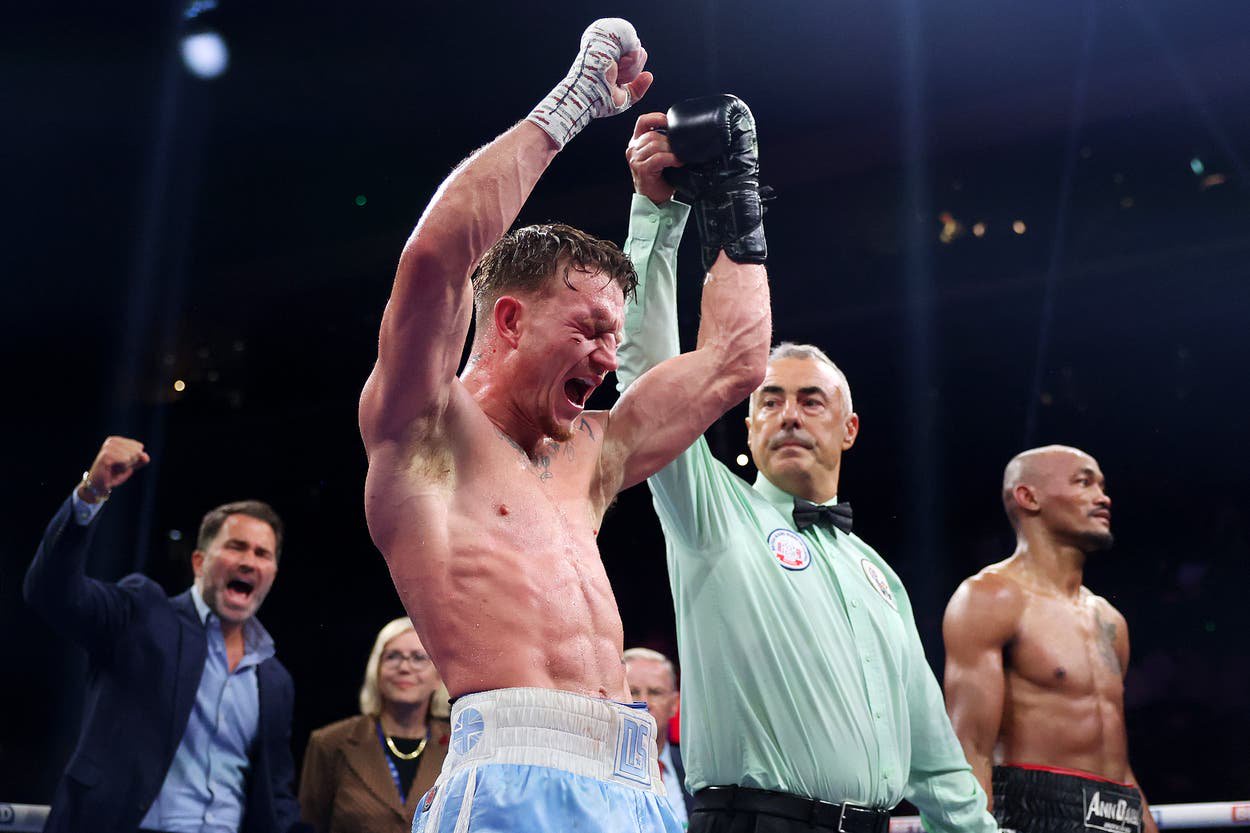 Dalton Smith celebrates as his promoter Eddie Hearn (far left) does the same