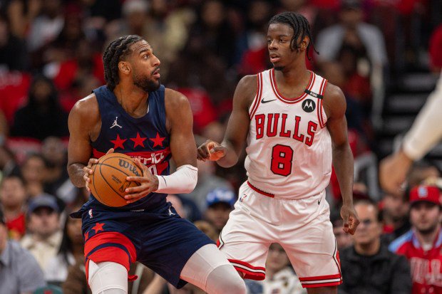 Bulls forward Caleb Wilson (8) defends against Wizards center Alex Sarr in the first quarter Saturday, Oct. 24, 2026, at the United Center. (Arthur Maiorella/Chicago Tribune)