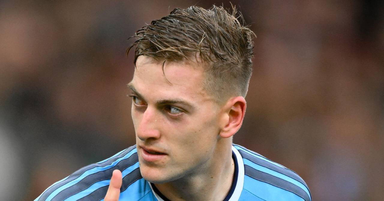 Footballer Liam Delap raising a finger from his right arm and looking to his right while playing for Premier League team Nottingham Forest Football Club in a light blue shirt with black trim and white collar