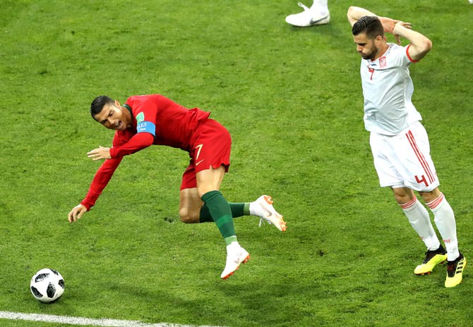 Spain's Pique accuses Ronaldo of diving after thrilling draw - Rediff Sports