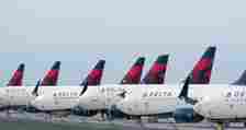 Many Delta Air Lines Boeing 737s Parked side by side.