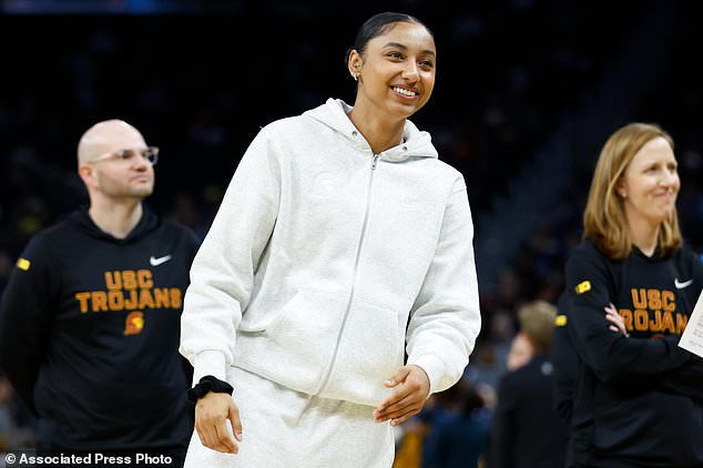 FILE - USC guard Juju Watkins (12) looks on from the sideline before the game against California during an NCAA basketball game on Dec. 21, 2025, in San Francisco. (AP Photo/Lachlan Cunningham, File)