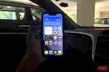 a man holding an iPhone inside a car with Vehicle Motion Cues turned on