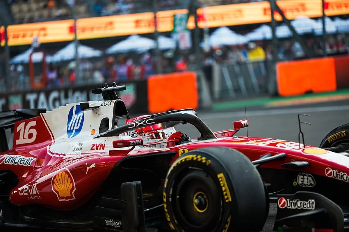 Ferrari F1 car number 16 with a driver in helmet on track at the Mexico City GP, passing orange barriers and Pirelli-branded signage.