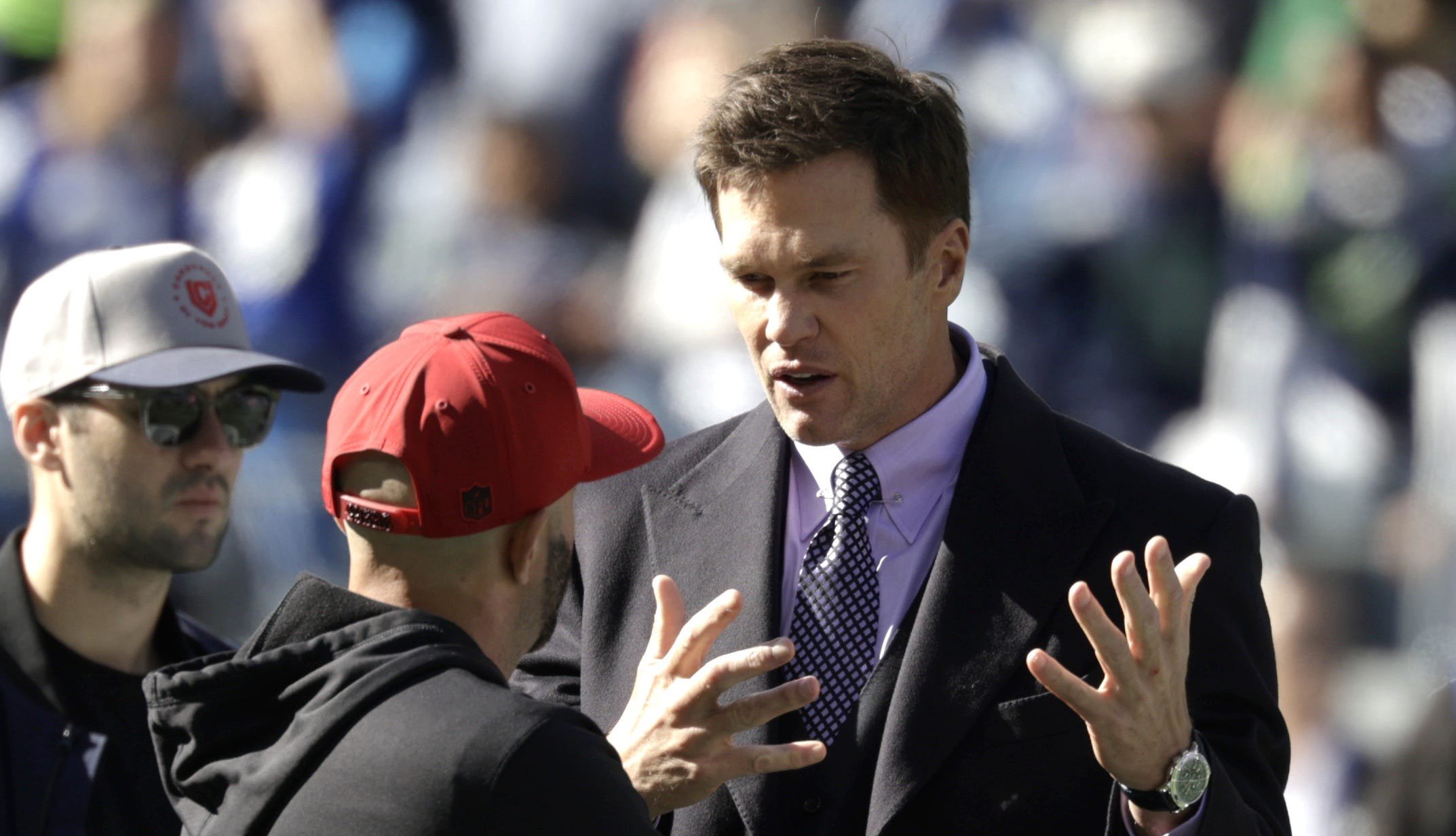 Oct 11, 2026; Seattle, Washington, USA;  FOX Sports lead NFL analyst Tom Brady chats on the field before a game between the San Francisco 49ers and the Seattle Seahawks at Lumen Field.  Mandatory Credit: Joe Nicholson-Imagn Images