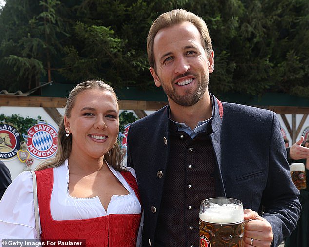 Kane and his wife Kate (left) has settled into life in Germany since moving there three years ago