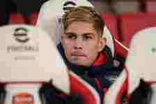 Emile Smith Rowe of Arsenal looks on from the substitutes bench prior to the Emirates FA Cup Third Round match between Arsenal and Liverpool at Emi...