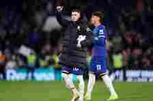 Cole Palmer of Chelsea celebrates victory whilst holding the match ball, after scoring four goals in the Premier League match between Chelsea FC and Everton FC at Stamford Bridge on April 15, 2024