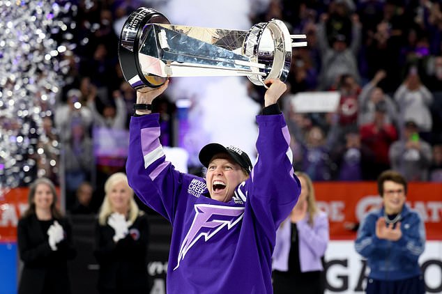 FILE - Minnesota Frost forward Kendall Coyne Schofield celebrates with the Walter Cup after her team won the PWHL hockey finals against the Ottawa Charge, May 26, 2025, in St. Paul, Minn. (AP Photo/Ellen Schmidt, File)