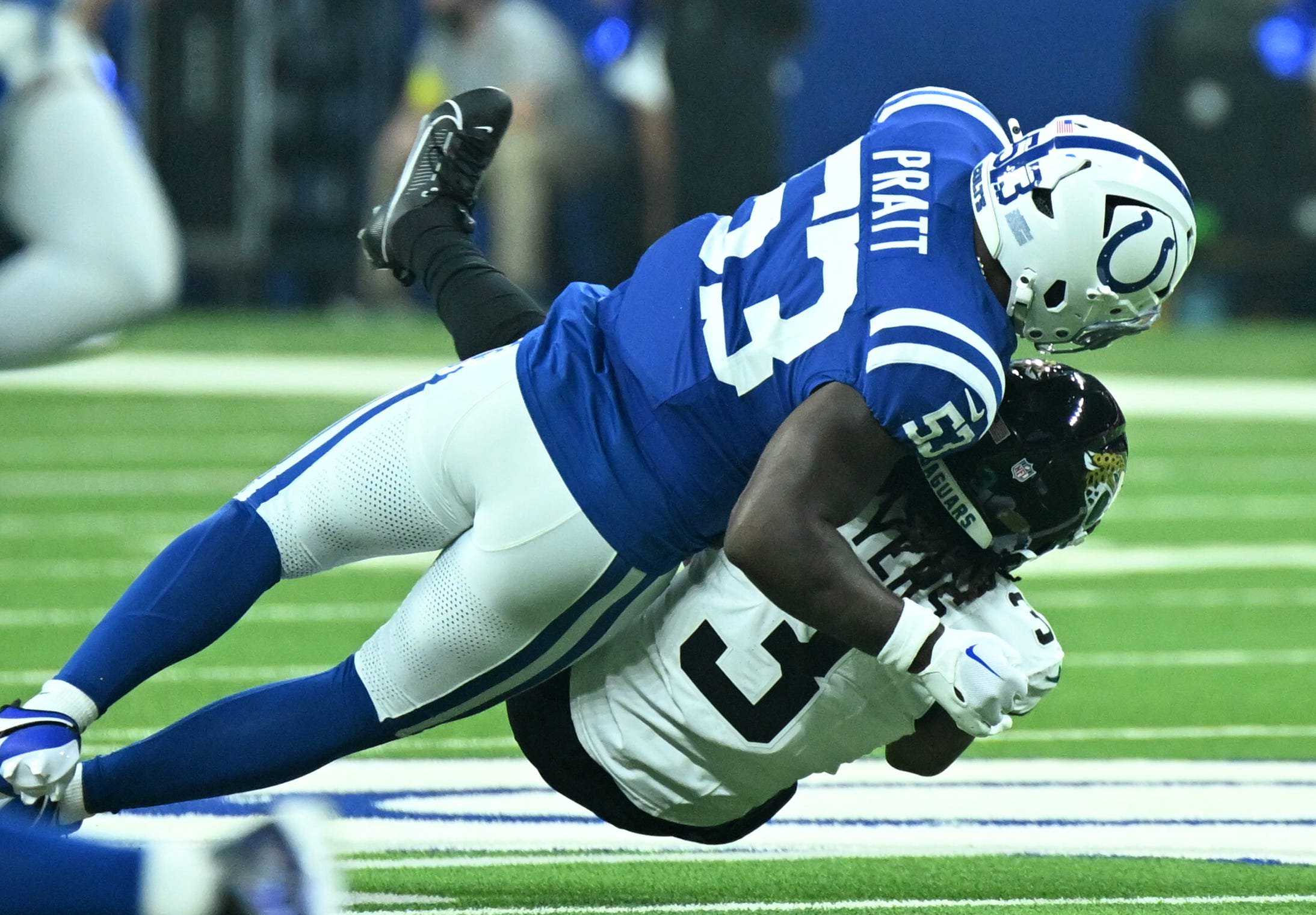 Dec 28, 2025; Indianapolis, Indiana, USA; Indianapolis Colts linebacker Germaine Pratt (53) tackles Jacksonville Jaguars wide receiver Jakobi Meyers (3) during the first half at Lucas Oil Stadium. Mandatory Credit: Robert Goddin-Imagn Images