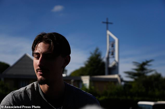 Villanova basketball team's Luigi Suigo talks to journalists prior to the start of the men's basketball team training session in Rome, Thursday, Oct. 29, 2026. (AP Photo/Gregorio Borgia)