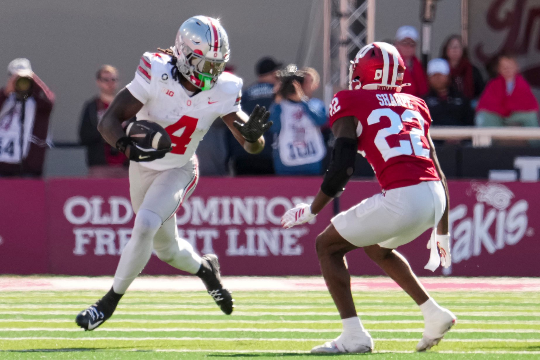 Ohio State Buckeyes wide receiver Jeremiah Smith (4) runs past Indiana Hoosiers defensive back Jamari Sharpe (22) during the NCAA football game at Memorial Stadium Stadium in Bloomington, Ind. on Oct. 17, 2026.