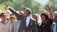 Nelson Mandela and wife Winnie raise fists upon his release from Victor Verster prison, 11 February 1990 in Paarl