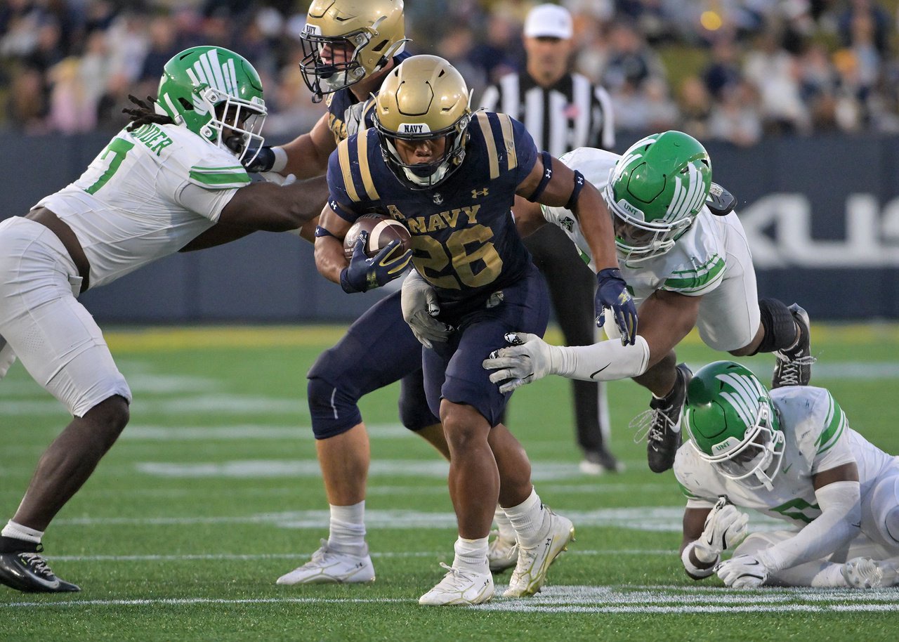 Navy Midshipmen running back Michael Barrow #26 has a big run in the third quarter setting up a Navy touchdown. The visiting North Texas Mean Green defeat the Navy Midshipmen, 49-39, in an NCAA football game Saturday at Navy-Marine Corps Memorial Stadium in Annapolis. (Paul W. Gillespie/Staff)