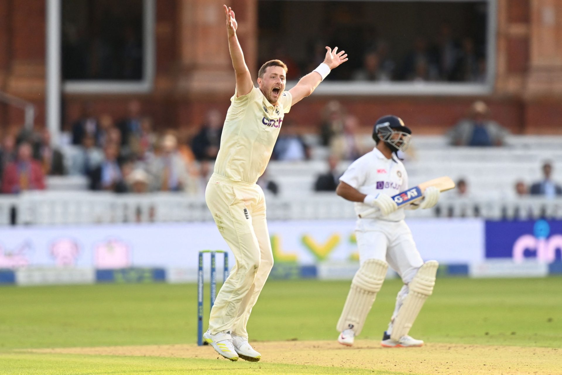 England's Ollie Robinson (L) appeals unsuccessfully for the wicket of India's Ajinkya Rahane on the first day of the second cricket Test match between England and India at Lord's cricket ground in London on August 12, 2021. - - RESTRICTED TO EDITORIAL USE. NO ASSOCIATION WITH DIRECT COMPETITOR OF SPONSOR, PARTNER, OR SUPPLIER OF THE ECB (Photo by Glyn KIRK / AFP) / RESTRICTED TO EDITORIAL USE. NO ASSOCIATION WITH DIRECT COMPETITOR OF SPONSOR, PARTNER, OR SUPPLIER OF THE ECB (Photo by GLYN KIRK/AFP via Getty Images)