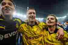 Marcel Sabitzer (R), and Marco Reus (C) of Borussia Dortmund celebrate after the UEFA Champions League semi-final second leg football match between Paris Saint-Germain (PSG) and Borussia Dortmund