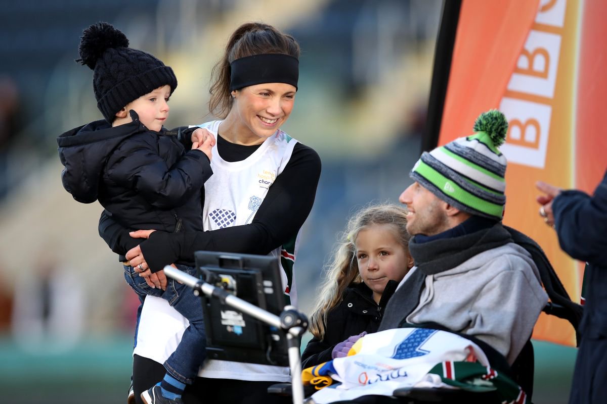 Rob Burrow gathers with his family after Ex-Leeds Rhinos rugby league player Kevin Sinfield completes his Extra Mile Challenge at Emerald Headingley Stadium on November 23, 2021 in Leeds, England. Sinfield aims to run 101 miles in 24 hours in aid of motor neurone disease research.