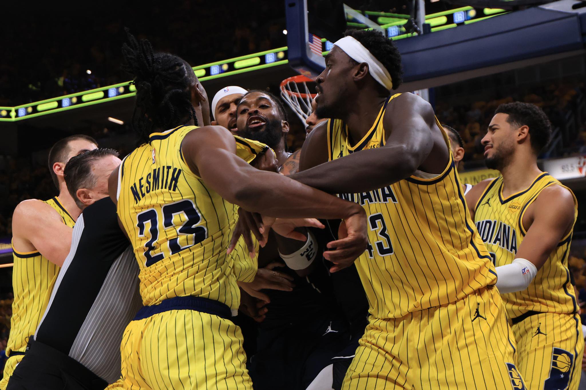 Aaron Nesmith (23) of the Indiana Pacers and Naji Marshall (3) of the Dallas Mavericks exchange words during the second quarter at Gainbridge Fieldhouse on October 23, 2026 in Indianapolis, Indiana. 