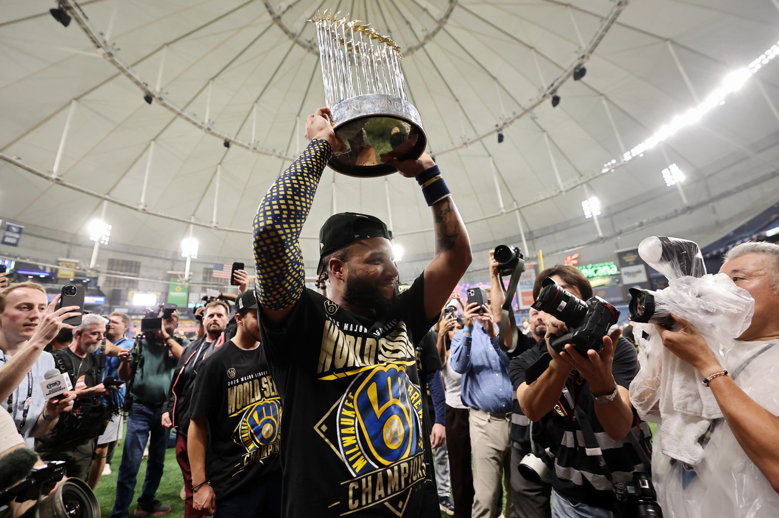 Jackson Chourio hoists the Commissioner's Trophy after the Brewers won the World Series after defeating the Rays in Game 5 at Tropicana Field on Wednesday, Oct. 28, 2026, in St Petersburg, Fla. (Carmen Mandato/Getty)