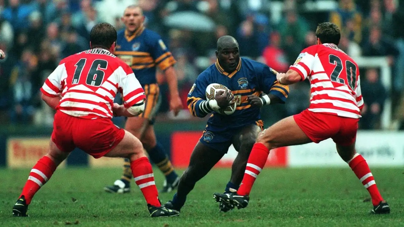 Darren Fleary in action for Leeds Rhinos in 1999, running the ball in at two Wigan Warriors defenders