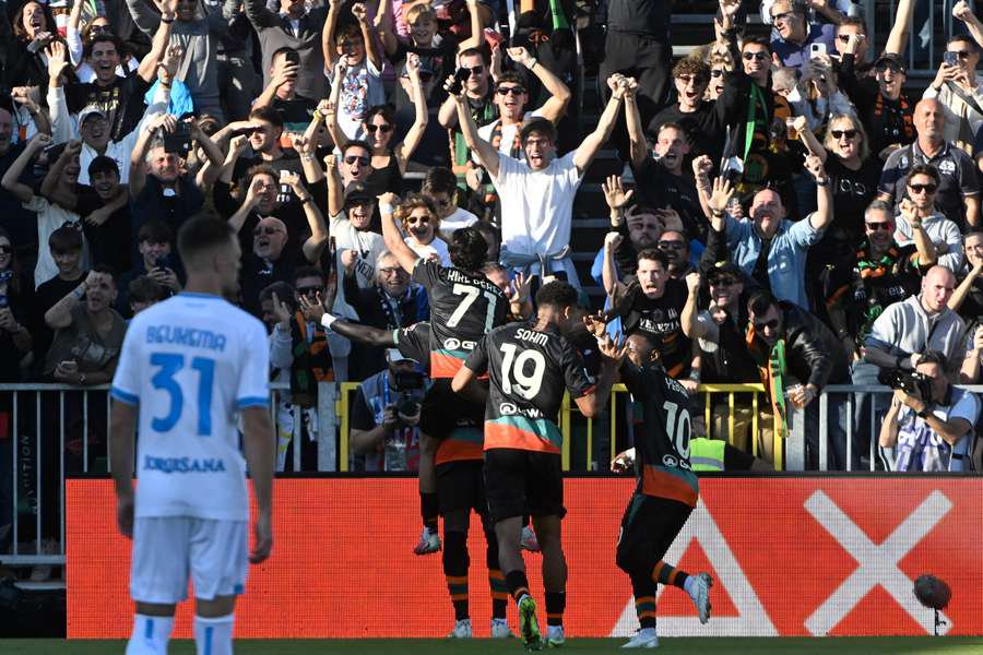 Adams celebrates winning goal with teammates